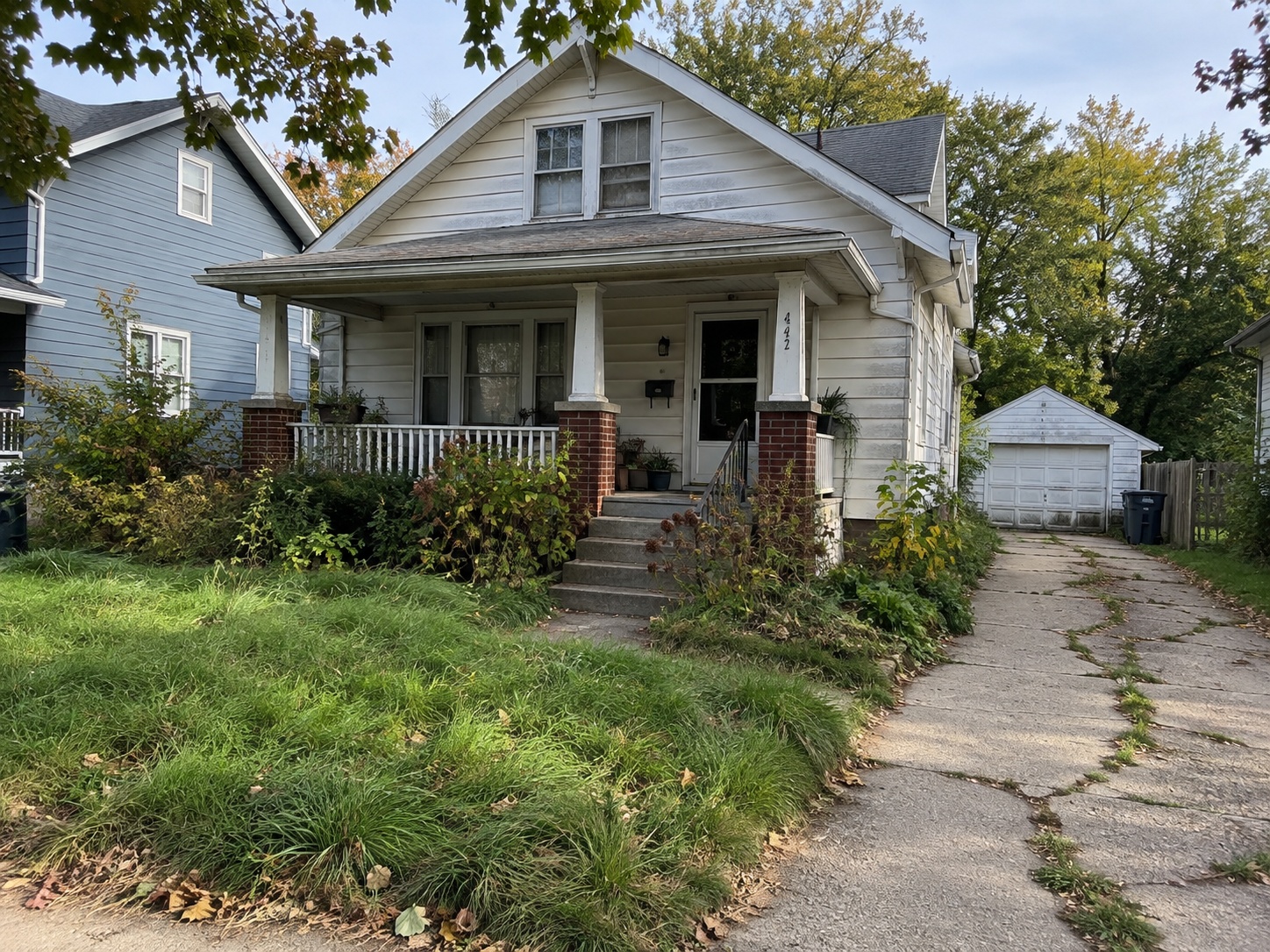 Replaceable hero photo showing a Michigan property that needs work